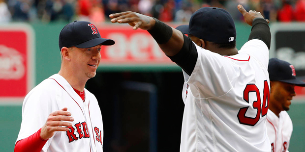 Boston Red Sox's David Ortiz, right,  waits to give relief pitcher Brad Ziegler a hug after their 4...