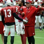 Coach Bruce Arians instructs receiver Jaron Brown during training camp on Aug. 1. (Photo by Adam Green/Arizona Sports)