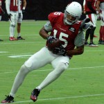 Receiver Michael Floyd turns up the field during training cap Aug. 2. (Photo by Adam Green/Arizona Sports)