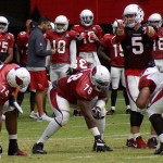 QB Drew Stanton signals while linemen D.J. Humphries and Earl Watford wait for the snap during training camp Aug. 8. (Photo by Adam Green/Arizona Sports)