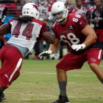 Left tackle Jared Veldheer prepares to block LB Markus Golden during training camp Aug. 10. (Photo by Adam Green)