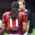 QB Carson Palmer chats with WR Larry Fitzgerald during training camp on Aug. 1. (Photo by Adam Green/Arizona Sports)