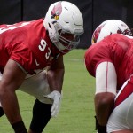 Calais Campbell lines up for a drill during training camp Aug. 22. (Photo by Adam Green/Arizona Sports)