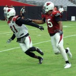Cornerback Patrick Peterson covers receiver Michael Floyd during training camp Aug. 4. (Photo by Adam Green/Arizona Sports)