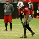 Coach Bruce Arians watches WR Larry Fitzgerald during training camp Aug. 10. (Photo by Adam Green)
