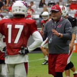 Coach Bruce Arians gives instruction to receiver Franky Okafor during training camp Aug. 5. (Photo by Adam Green/Arizona Sports)