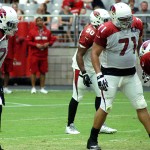 Defensive linemen Red Bryant and Olsen Pierre during training cap Aug. 2. (Photo by Adam Green/Arizona Sports)