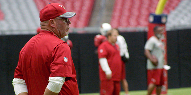 Coach Bruce Arians watches during training camp Aug. 9. (Photo by Adam Green/Arizona Sports)...