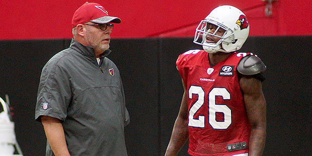 Cardinals coach Bruce Arians talks with cornerback Brandon Williams during a training camp practice...
