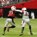 Receiver Jaron Brown gets bumped off the line by cornerback Alan Ball at Arizona Cardinals training camp Tuesday, August 9, 2016. (Photo: Vince Marotta/Arizona Sports)