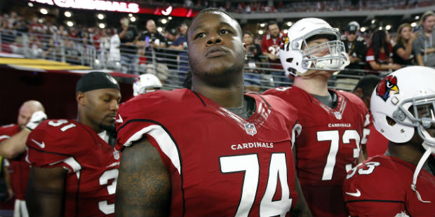 Arizona Cardinals offensive lineman D.J. Humphries (74) waits to take the field with teammates duri...