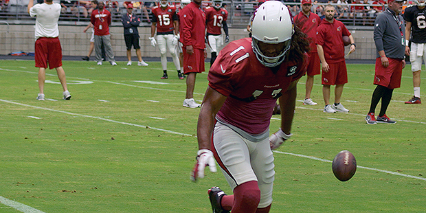 Receiver Larry Fitzgerald is unable to hang onto a pass during a drill at training camp on Aug. 5. ...