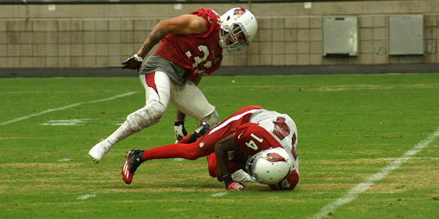 Cardinals safety Tyrann Mathieu stands over J.J. Nelson after tackling him in a training camp pract...
