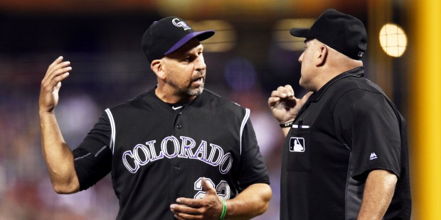 Colorado Rockies manager Walt Weiss talks to home plate umpire Eric Cooper in the fourth inning of ...