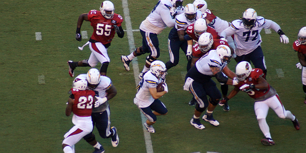 Chargers RB Danny Woodhead looks for some room to run against Arizona's defense during a training c...