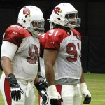 Defensive linemen Xavier Williams (94) and Ed Stinson (91) get ready for a play at Arizona Cardinals training camp Tuesday, August 9, 2016. (Photo: Vince Marotta/Arizona Sports)