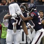 Houston Texans outside linebacker John Simon (51) celebrates with teammates after he returned an interception for a touchdown during the first half of an NFL preseason football game against the Arizona Cardinals, Sunday, Aug. 28, 2016, in Houston. (AP Photo/Eric Christian Smith)
