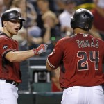 Arizona Diamondbacks' Yasmany Tomas (24) celebrates his home run against the New York Mets with Brandon Drury, left, during the fourth inning of a baseball game Wednesday, Aug. 17, 2016, in Phoenix. (AP Photo/Ross D. Franklin)