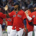 Boston Red Sox's Hanley Ramirez, center, celebrates with teammates after the Red Sox defeated the Arizona Diamondbacks 9-4 in a baseball game in Boston, Friday, Aug. 12, 2016. (AP Photo/Michael Dwyer)