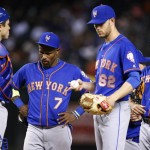 New York Mets pitcher Erik Goeddel (62) stands around the mound with T.J. Rivera (54), Jose Reyes (7) and catcher Travis d'Arnaud, left, after Goeddel gave up a three-run home run to Arizona Diamondbacks' Rickie Weeks Jr. during the fifth inning of a baseball game Wednesday, Aug. 17, 2016, in Phoenix. (AP Photo/Ross D. Franklin)