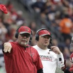 Arizona Cardinals head coach Bruce Arians, left, challenges a call during the first half of an NFL preseason football game against the Houston Texans, Sunday, Aug. 28, 2016, in Houston. (AP Photo/JR)
