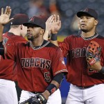 Arizona Diamondbacks' Rickie Weeks Jr. (5) and Yasmany Tomas, right, celebrate with teammates after a baseball game against the New York Mets on Wednesday, Aug. 17, 2016, in Phoenix. Weeks and Tomas each had two home runs on the night, as Diamondbacks defeated the Mets 13-5. (AP Photo/Ross D. Franklin)