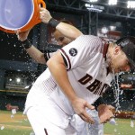 Arizona Diamondbacks' Brandon Drury, right, gets a bucket of ice dumped on him by Chris Owings, left, after Drury's game-winning sacrifice fly against the Atlanta Braves after a baseball game Wednesday, Aug. 24, 2016, in Phoenix. The Diamondbacks defeated the Braves 10-9. (AP Photo/Ross D. Franklin)