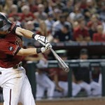Arizona Diamondbacks' Chris Owings connects for a run-scoring triple against the Milwaukee Brewers during the fifth inning of a baseball game Sunday, Aug. 7, 2016, in Phoenix. (AP Photo/Ross D. Franklin)