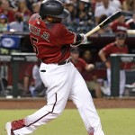 
              Arizona Diamondbacks' Rickie Weeks Jr. follows through on his two-run home run against the New York Mets during the fourth inning of a baseball game Wednesday, Aug. 17, 2016, in Phoenix. (AP Photo/Ross D. Franklin)
            