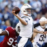 San Diego Chargers quarterback Kellen Clemens, right, passes while under pressure from Arizona Cardinals defensive end Calais Campbell during the first half of a preseason NFL football game, Friday, Aug. 19, 2016, in San Diego. (AP Photo/Rick Scuteri)