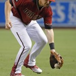 Arizona Diamondbacks' Brandon Drury is unable to field a grounder hit by Washington Nationals' Danny Espinosa during the sixth inning of a baseball game Wednesday, Aug. 3, 2016, in Phoenix. Espinosa was given a hit on the play. (AP Photo/Ross D. Franklin)