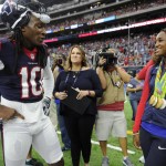 Olympic gold medalist Simone Manuel, right, visits with Houston Texans wide receiver DeAndre Hopkins, left, prior to an NFL preseason football game against the Arizona Cardinals, Sunday, Aug. 28, 2016, in Houston. (AP Photo/Eric Christian Smith)