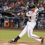 Arizona Diamondbacks' Jake Lamb connects for a run-scoring single against the New York Mets during the first inning of a baseball game, Monday, Aug. 15, 2016, in Phoenix. (AP Photo/Ross D. Franklin)