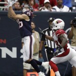Houston Texans wide receiver Will Fuller (15) makes a catch for a touchdown as Arizona Cardinals cornerback Brandon Williams (26) defends the play during the first half of an NFL preseason football game, Sunday, Aug. 28, 2016, in Houston. (AP Photo/Jeff Roberson)