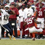 San Diego Chargers wide receiver Keenan Allen, left, jukes around Arizona Cardinals defensive back Marqui Christian during the first half of a preseason NFL football game, Friday, Aug. 19, 2016, in San Diego. (AP Photo/Denis Poroy)