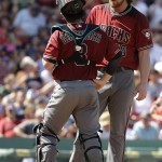 Arizona Diamondbacks catcher Tuffy Gosewisch (8) and relief pitcher Adam Loewen (58) talk on the mound during the fifth inning of a baseball game Sunday, Aug. 14, 2016, in Boston. The Red Sox won 16-2. (AP Photo/Steven Senne)