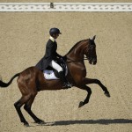 Luca Roman, of Italy, rides Castlewoods Jake in the equestrian eventing dressage competition at the 2016 Summer Olympics in Rio de Janeiro, Brazil, Saturday, Aug. 6, 2016. (AP Photo/John Locher)
