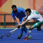 Ireland's Chris Cargo fights for the ball with India's Raghunath Vokkaliga during a men's field hockey match at the 2016 Summer Olympics in Rio de Janeiro, Brazil, Saturday, Aug. 6, 2016. (AP Photo/Dario Lopez-Mills)