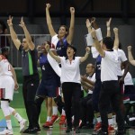 France head coach Valerie Garnier and her team react after a three-point basket during the second half of a women's basketball game at the Youth Center at the 2016 Summer Olympics in Rio de Janeiro, Brazil, Saturday, Aug. 6, 2016. France defeated Turkey 55-39. (AP Photo/Carlos Osorio)