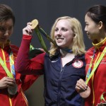 Virginia Thrasher, center, of the United States holds her gold medal for the Women's 10m Air Rifle competition during the award ceremony with the runner-up Du li, left, of China and third place Yi Siling, right, of China at Olympic Shooting Center at the 2016 Summer Olympics in Rio de Janeiro, Brazil, Saturday, Aug. 6, 2016. (AP Photo/Eugene Hoshiko)