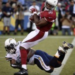 Arizona Cardinals running back David Johnson, top, runs the ball as San Diego Chargers inside linebacker Denzel Perryman tries to tackle him during the first half of a preseason NFL football game, Friday, Aug. 19, 2016, in San Diego. (AP Photo/Denis Poroy)