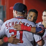 Washington Nationals' Max Scherzer, left, gets a hug from Wilmer Difo after Scherzer finished pitching the after the eighth inning of a baseball game against the Arizona Diamondbacks Wednesday, Aug. 3, 2016, in Phoenix. The Nationals defeated the Diamondbacks 8-3. (AP Photo/Ross D. Franklin)