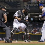 Arizona Diamondbacks catcher Welington Castillo, middle, loses the baseball as New York Mets' James Loney, right, and umpire Marvin Hudson, left, look on during the first inning of a baseball game, Tuesday, Aug. 16, 2016, in Phoenix. (AP Photo/Ross D. Franklin)