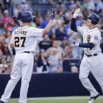 San Diego Padres' Patrick Kivlehan, right, is congratulated by pitcher Clayton Richard after hitting a home run during the fifth inning of a baseball game against the Arizona Diamondbacks, Saturday, Aug. 20, 2016, in San Diego. The home run by Patrick Kivlehan was his first Major League hit. (AP Photo/Don Boomer)