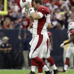 Arizona Cardinals quarterback Carson Palmer (3) walks off the field after throwing an interception for a touchdown return during the first half of an NFL preseason football game against the Houston Texans, Sunday, Aug. 28, 2016, in Houston. (AP Photo/JR)