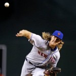 New York Mets' Noah Syndergaard throws a pitch against the Arizona Diamondbacks during the first inning of a baseball game, Tuesday, Aug. 16, 2016, in Phoenix. (AP Photo/Ross D. Franklin)
