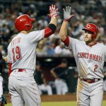 Cincinnati Reds' Zack Cozart (2) is congratulated by teammate Joey Votto after hitting a solo home run against Arizona Diamondbacks during the fourth inning of a baseball game, Saturday, Aug. 27, 2016, in Phoenix. (AP Photo/Ralph Freso)