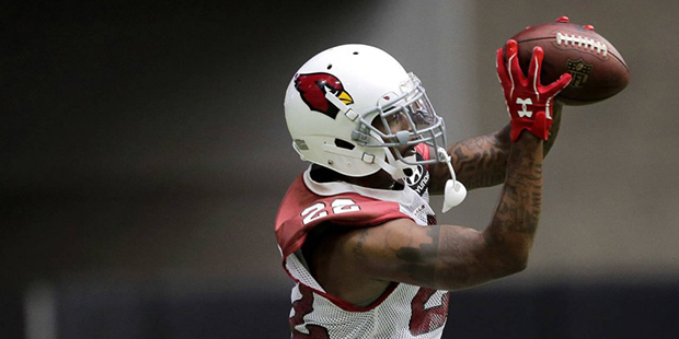 Arizona Cardinals' Tony Jefferson pulls in a pass during practice at the NFL football team's traini...