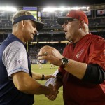 San Diego Chargers coach Mike McCoy, left, and Arizona Cardinals coach Bruce Arians shake hands after the Chargers defeated the Cardinals 19-3 in a preseason NFL football game, Friday, Aug. 19, 2016, in San Diego. (AP Photo/Rick Scuteri)