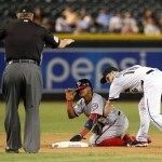Washington Nationals' Wilmer Difo is tagged late by Arizona Diamondbacks' Chris Owings (16) after stealing second base during the eighth inning of a baseball game, Tuesday, Aug. 2, 2016, in Phoenix. (AP Photo/Rick Scuteri)